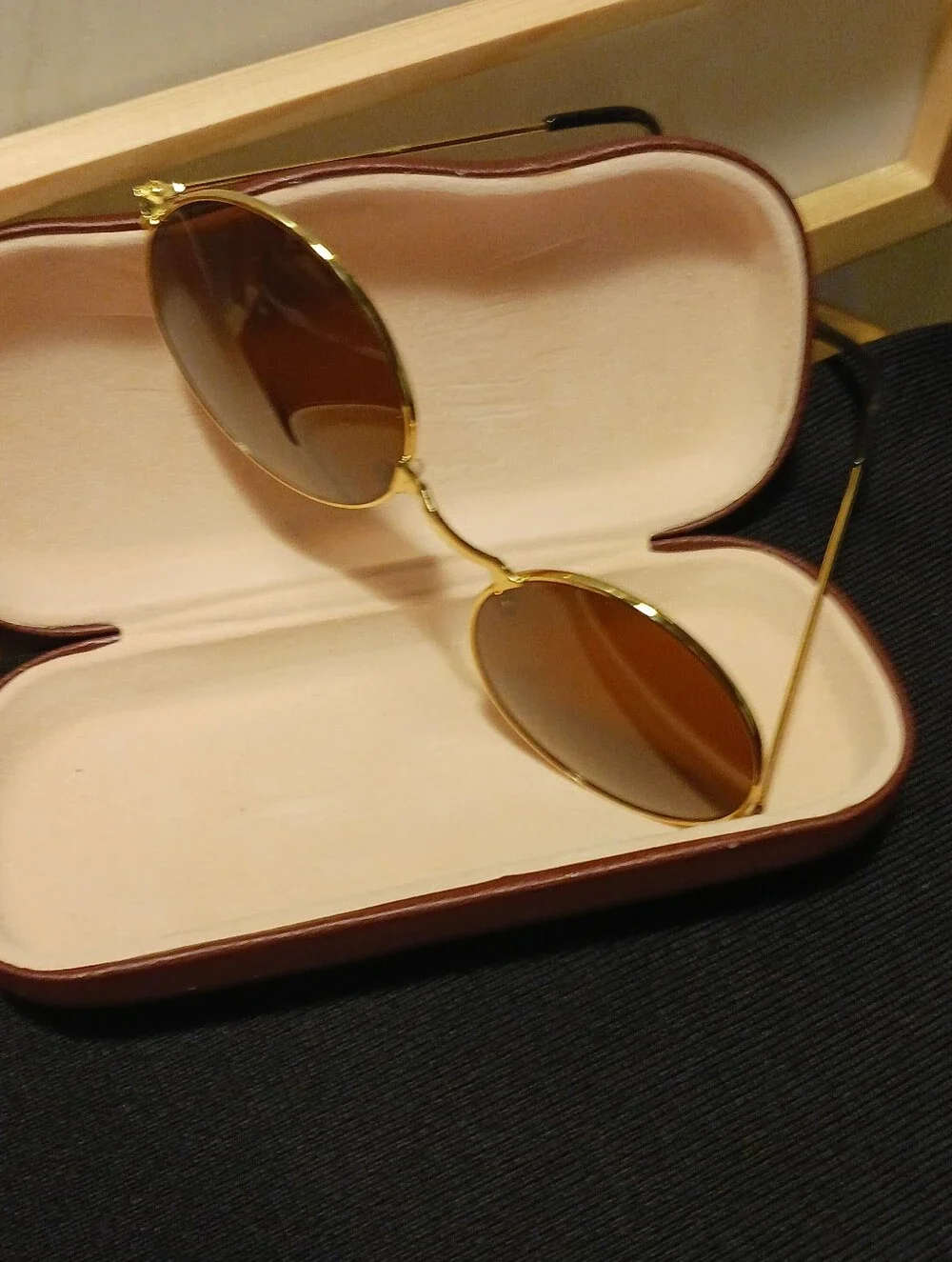 Gold Round Frame Sunglasses with Dark Glass Lenses Round Shaped.
